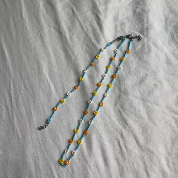 Yellow and blue beaded flower - Picture 2 of 3